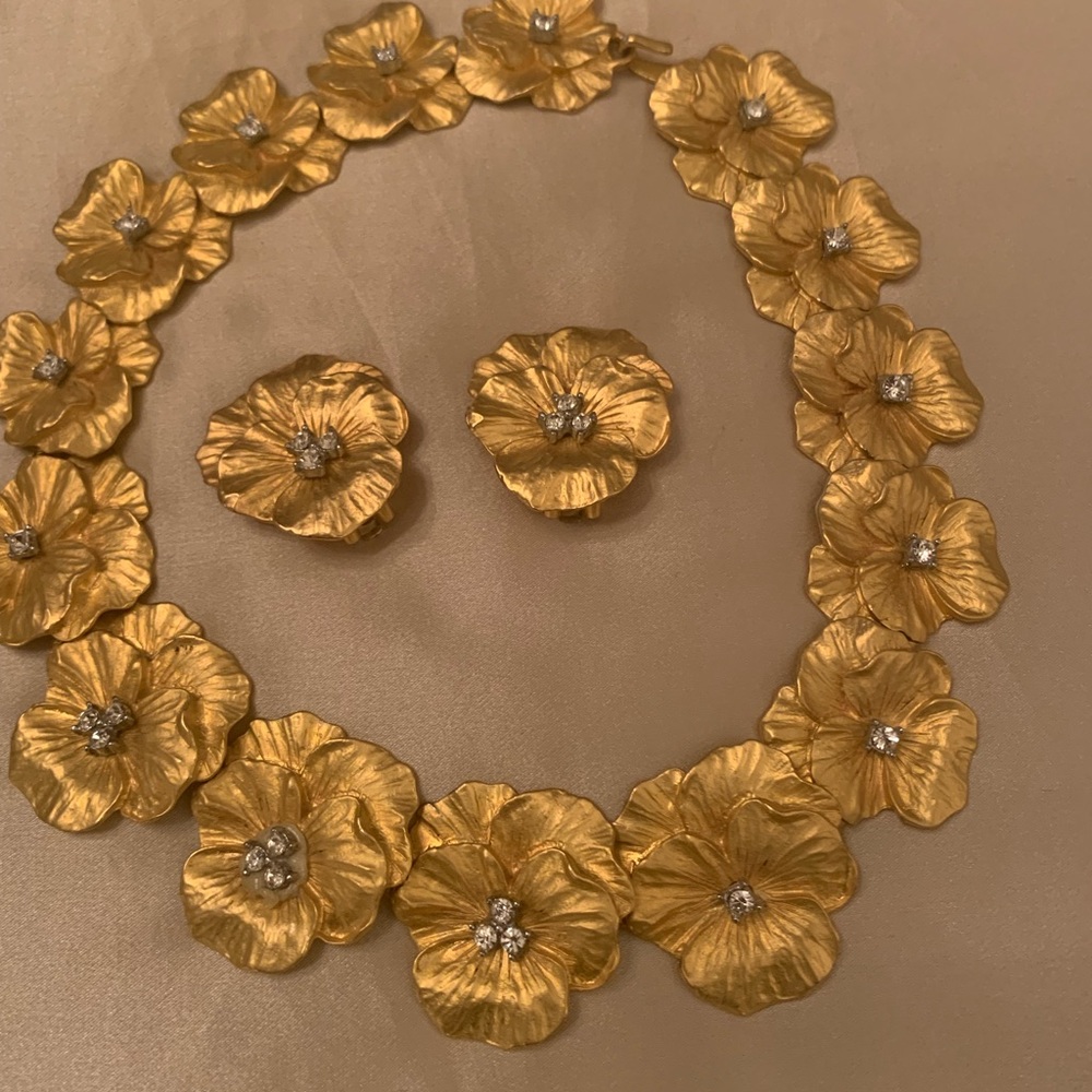 Gold tone choker and matching earrings.